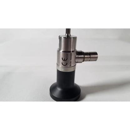 Silver and black dyonics autoclavable 4mm 70 degree arthroscope with cylindrical metallic body and textured grip section