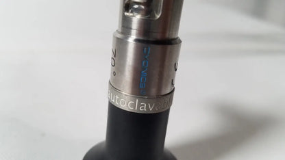 Silver metallic threaded connector engraved autoclavable d-vacs 30° attached to black body of dyonics autoclavable 4mm arthroscope