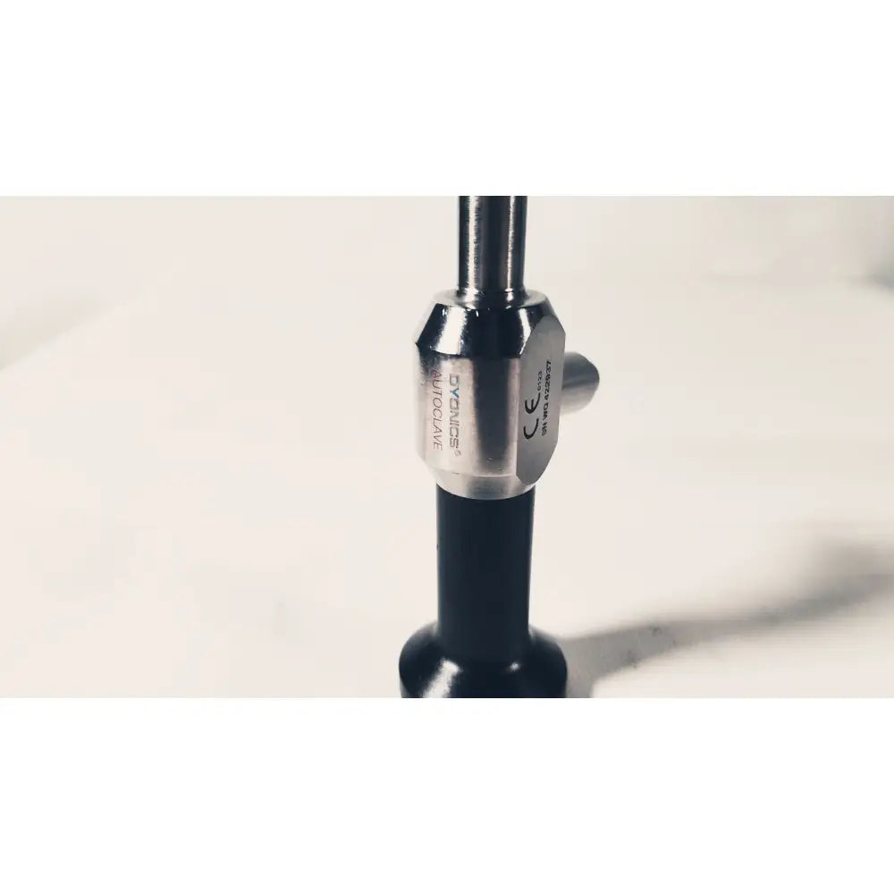 Silver-toned metallic hexagonal collar with engraved branding on black handle of dyonics autoclave degree 10mm laparoscope