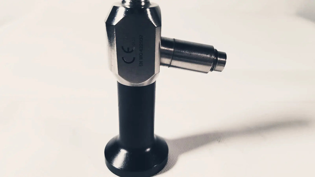 Black and silver dyonics autoclave 0 degree 10mm laparoscope with hexagonal metallic head and cylindrical black handle