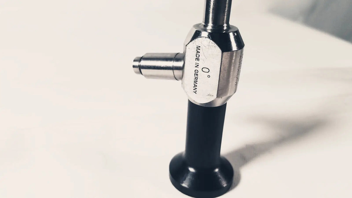 Silver and black dyonics autoclave degree 10mm laparoscope with metallic hexagonal knob marked made in Germany 0 degree