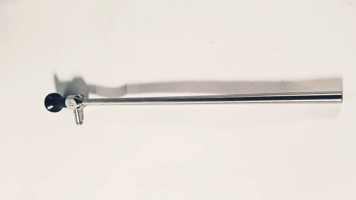 A sleek metallic dyonics autoclave degree 10mm laparoscope with a black circular lens and silver body