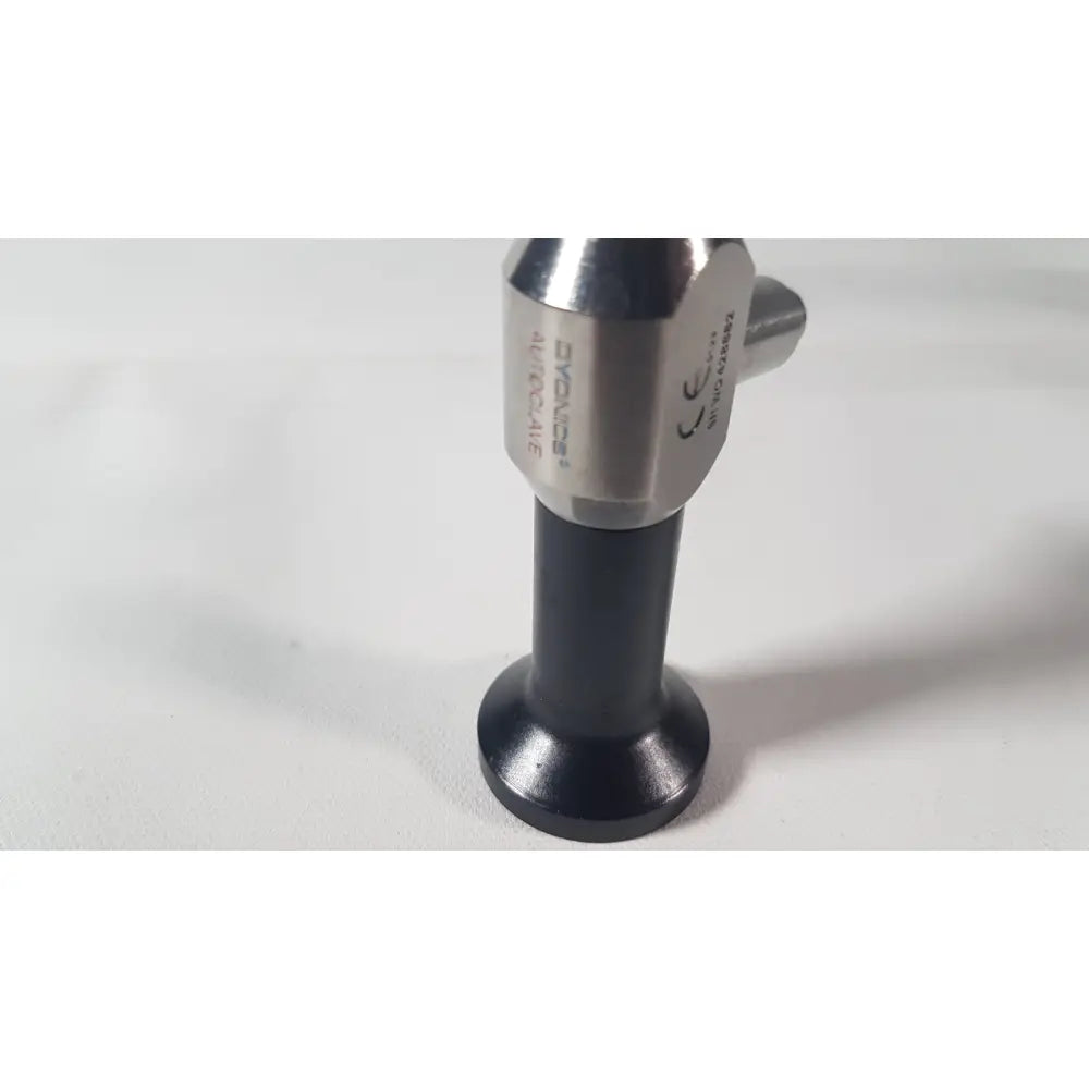 Silver and black dyonics autoclave ref 7207944 0° laparoscope with cylindrical metallic head and engraved markings on black base