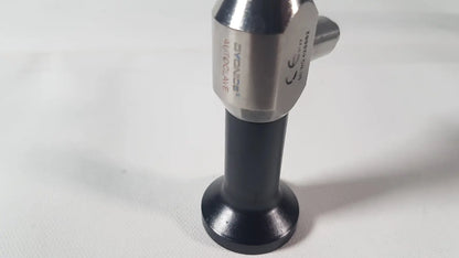 Silver and black dyonics autoclave ref 7207944 0° laparoscope with cylindrical metallic head and engraved markings on black base