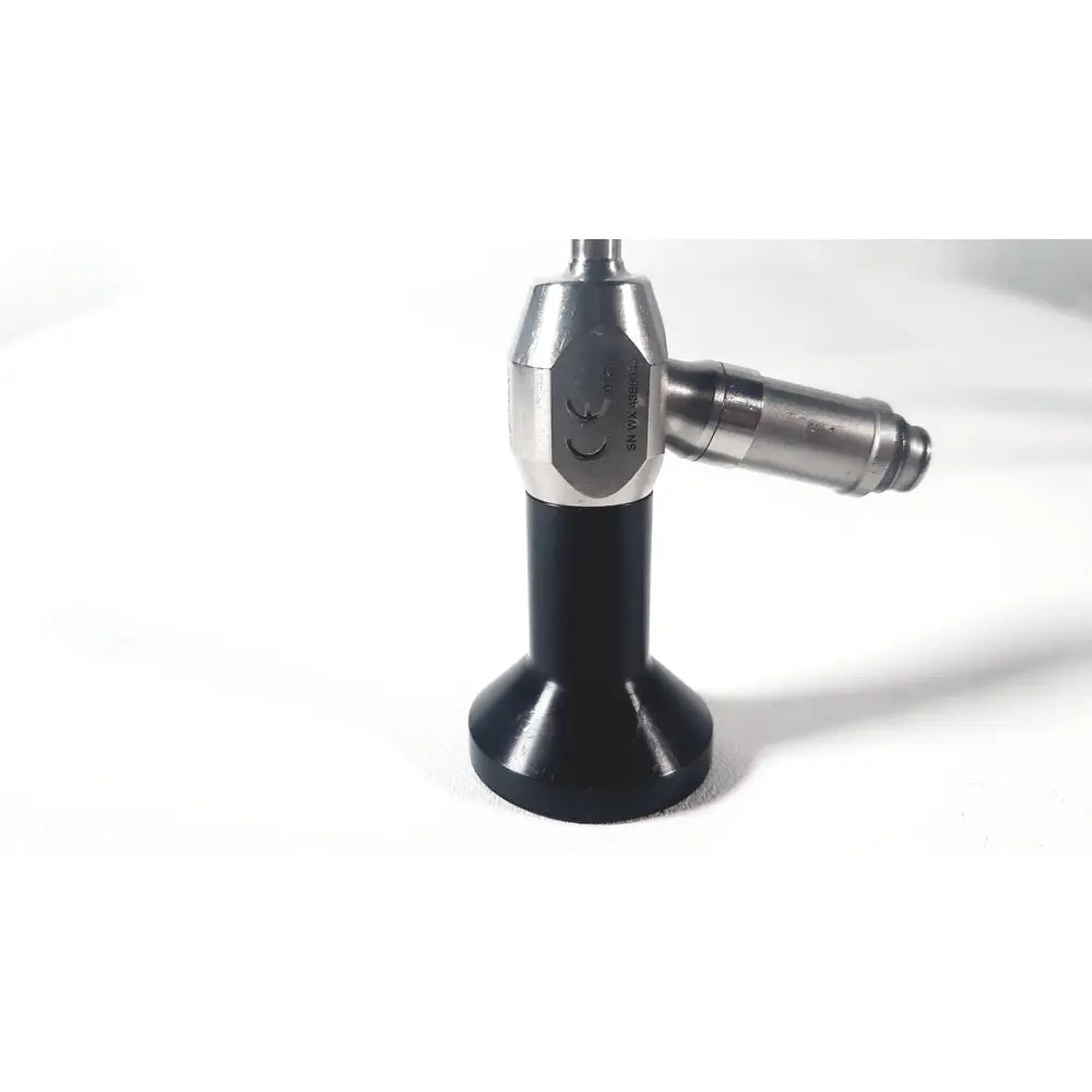 Silver and black dyonics autoclave ref 7207952 30 degree laparoscope with hexagonal metallic body labeled snw-4025c