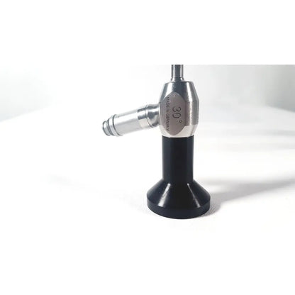 Dyonics autoclave ref 7207952 30 degree laparoscope with a sleek silver body and black base for surgical use