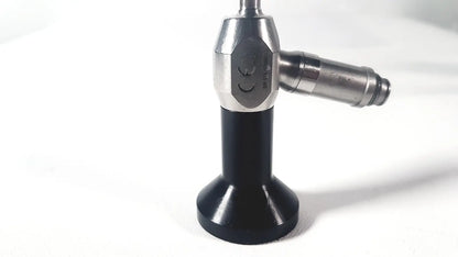 Silver and black dyonics autoclave ref 7207952 30 degree laparoscope with hexagonal metallic body labeled snw-4025c