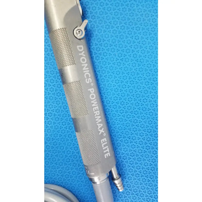 Silver metallic powermax elite shaver handpiece with textured grip and adjustment knob for medical equipment use