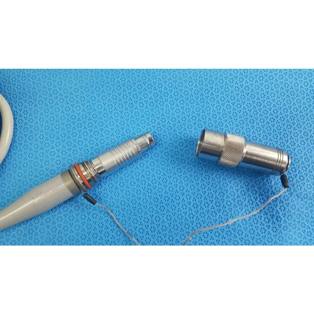 Dyonics powermax elite shaver handpiece silver dental handpiece with textured grip orange o-ring and gray handle medical equipment