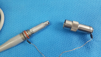 Dyonics powermax elite shaver handpiece silver dental handpiece with textured grip orange o-ring and gray handle medical equipment