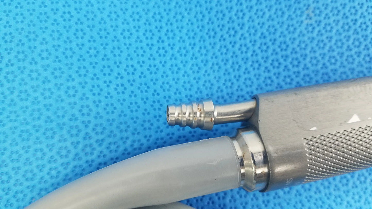 Silver metallic dyonics powermax elite shaver handpiece with textured grip and threaded connector for medical equipment use