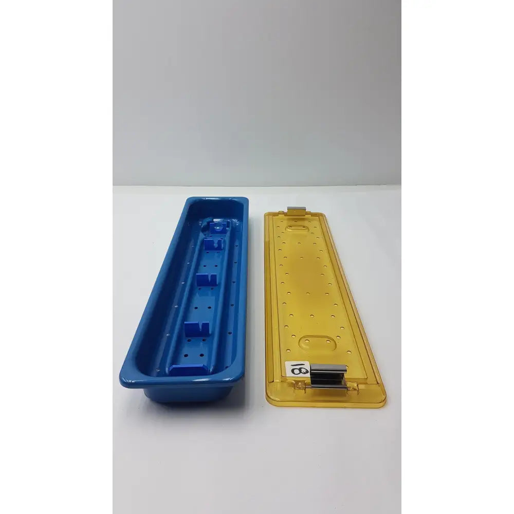 Blue and yellow plastic dyonics video sterilization soaking tray case designed for secure surgical instrument storage