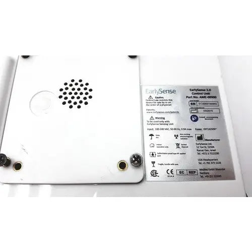 White plastic earlysence 2.0 control unit with black speaker grille and gold screw holes for reuse medical applications
