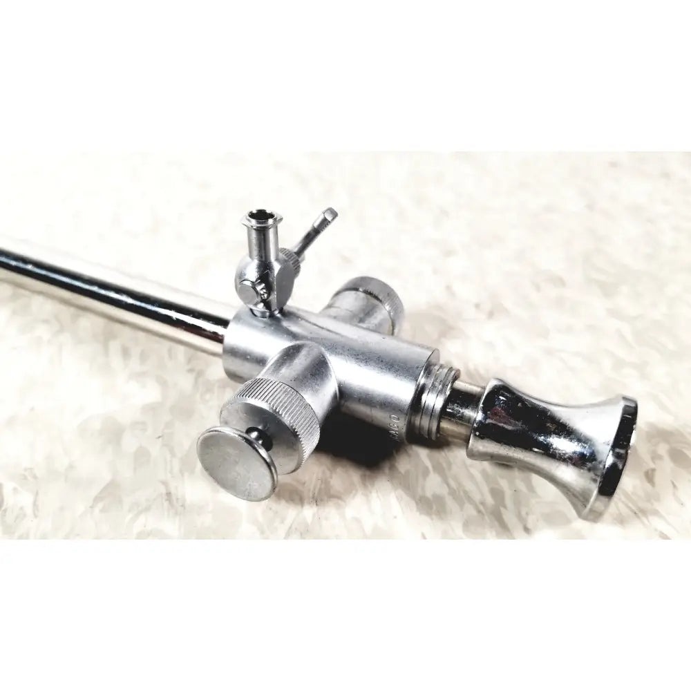 Shiny chrome medical endoscope with slender shaft and control knobs by eder instrument cat 1110 c 3 or gsh endoscope