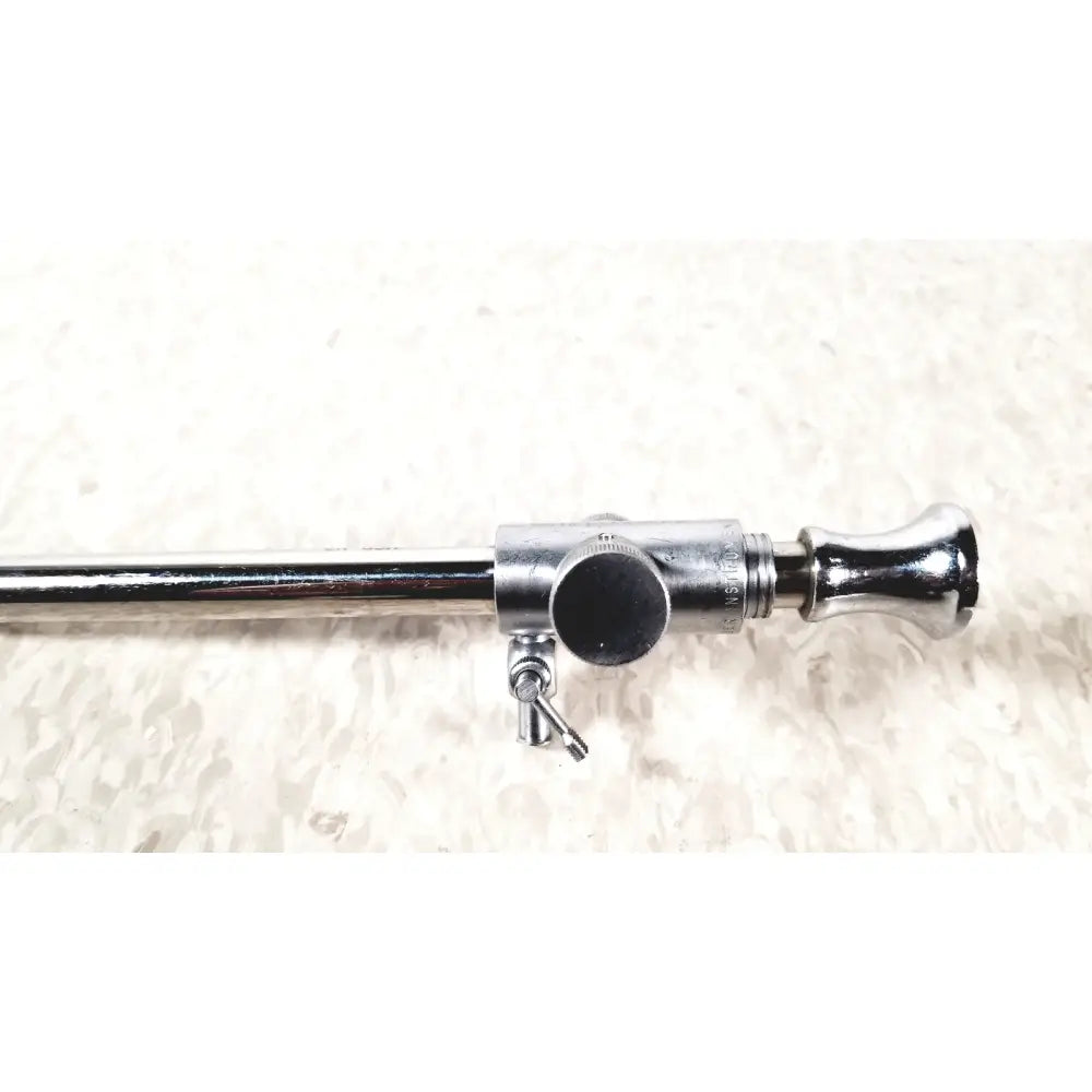 Shiny chrome medical endoscope with cylindrical body, adjustable knob, and threaded connector from eder instrument cat 1110 C/3