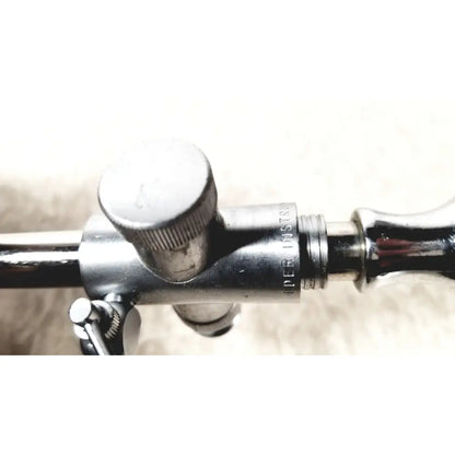 Silver metallic eder instrument cat medical instrument with engraved text and knurled adjustment knob for endoscope use