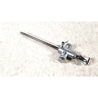 Silver-colored metal eder instrument cat surgical endoscope with long slender shaft and multiple adjustment knobs
