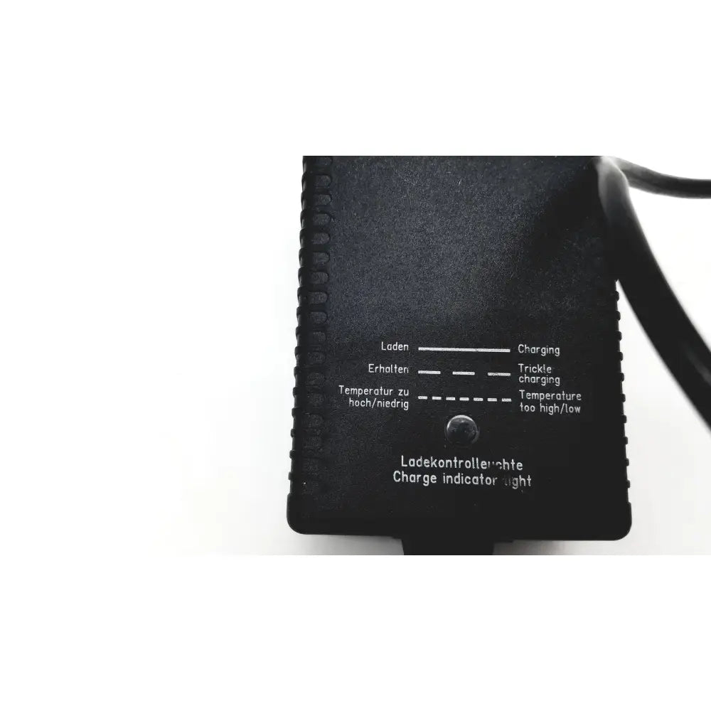 Black plastic eds adaptor charger with textured surface and bilingual charge indicator labels for electric vehicles