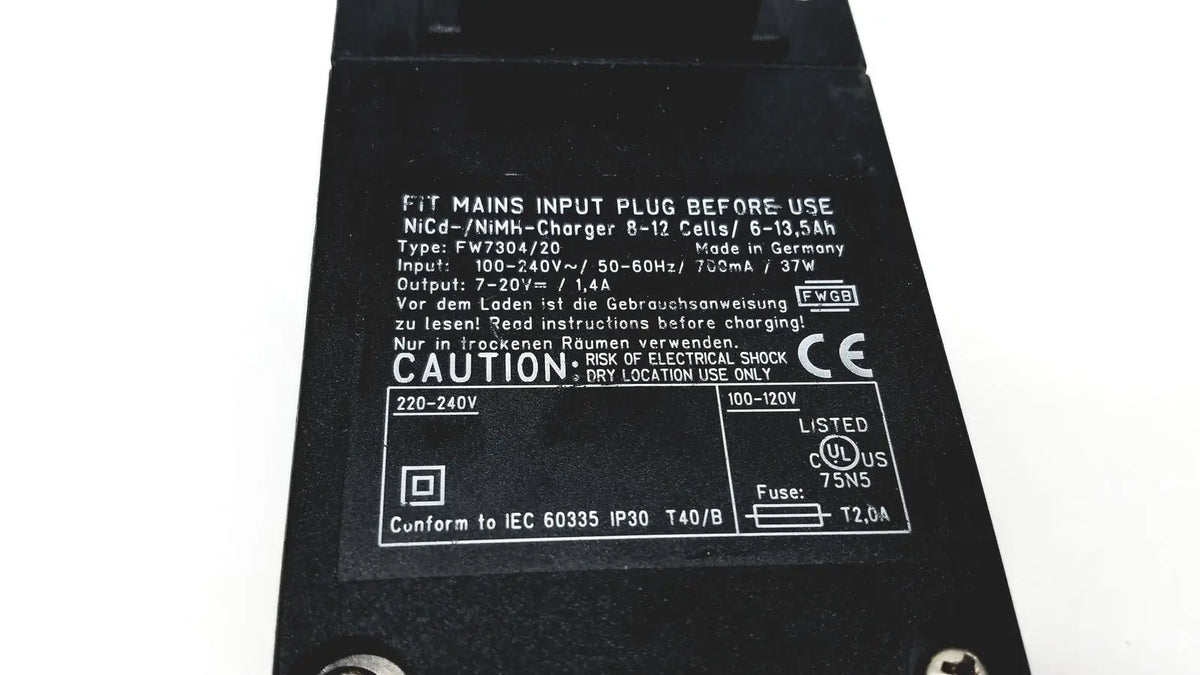 Black rectangular eds adaptor charger with white printed specifications and safety labels for reuse medical devices