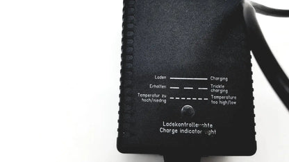 Black plastic eds adaptor charger with textured surface and bilingual charge indicator labels for electric vehicles