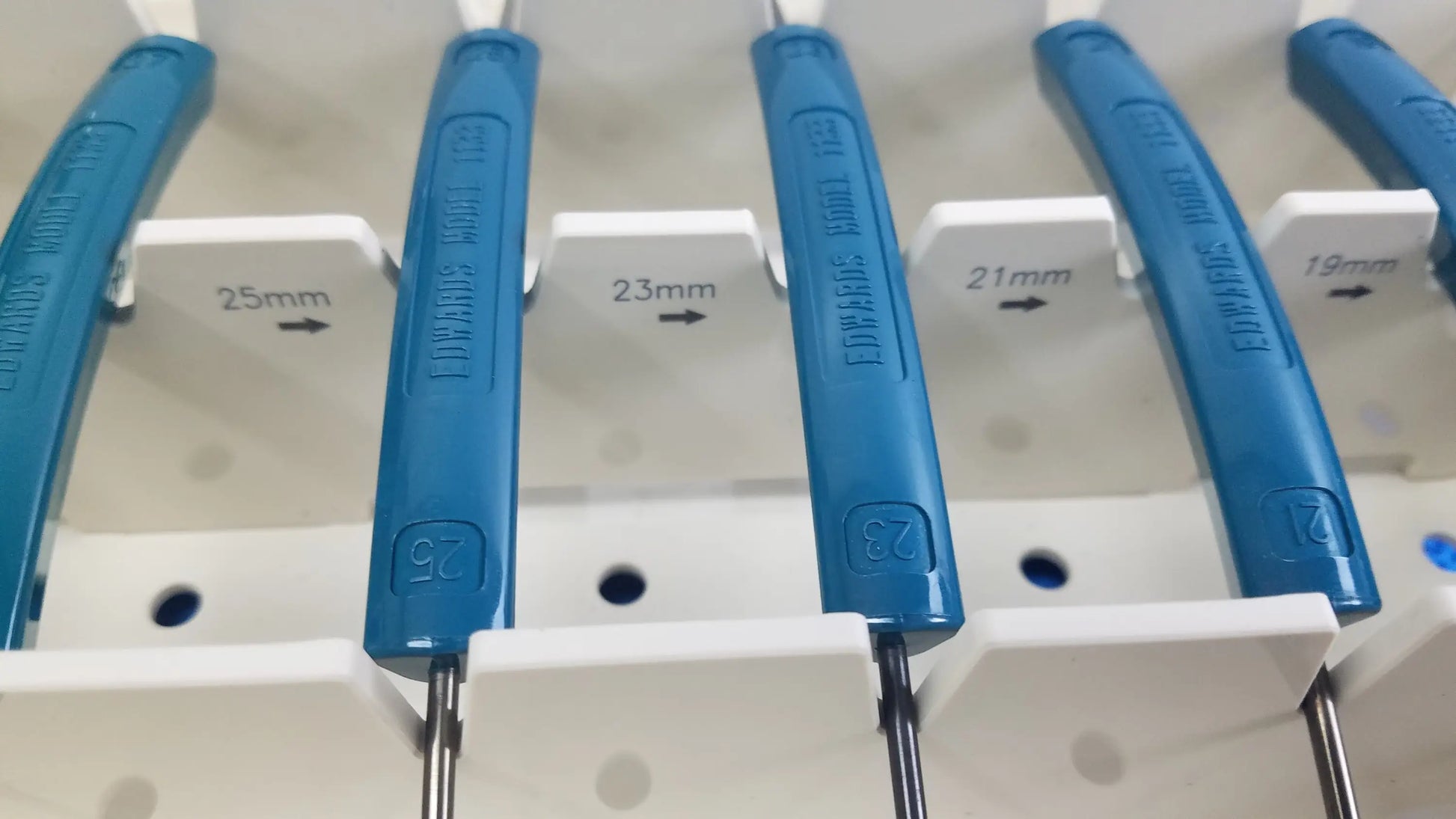 Blue plastic-handled screwdrivers with metal shafts marked in millimeters for edwards life science valve sizer set buy used medical equipment