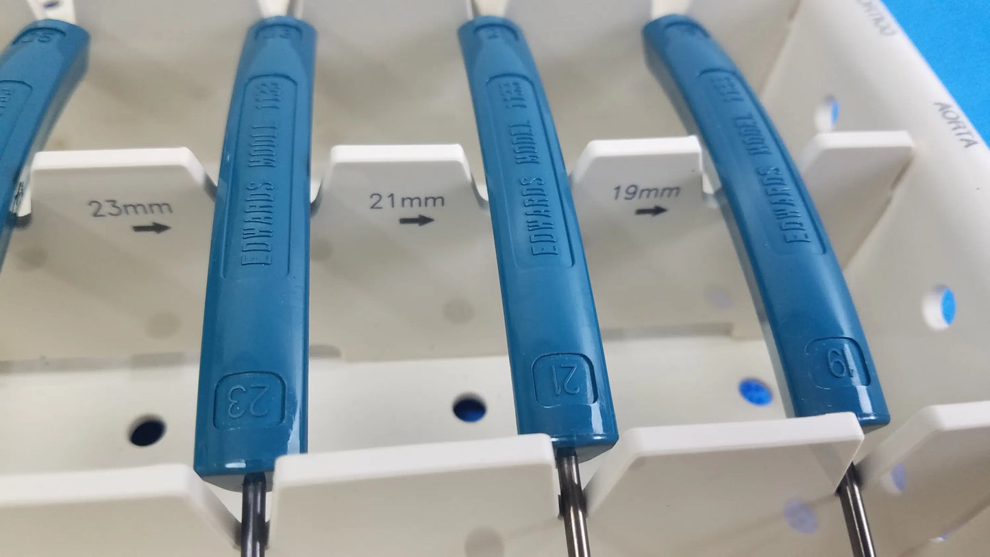 Blue plastic-handled dental impression forceps with engraved brand and size markings for buy used medical equipment