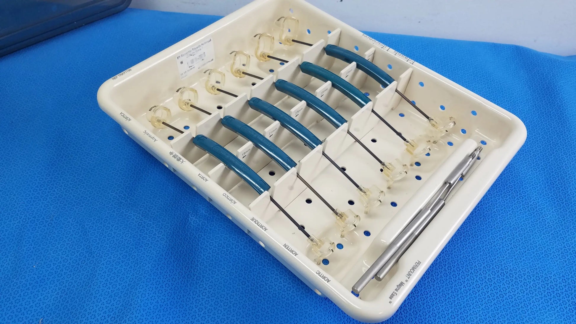 White plastic dental tray holding blue-handled glass tip instruments from Edwards Life Science aortic valve sizer set for buy used medical equipment
