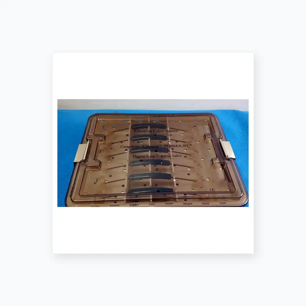Clear plastic surgical tray with labeled compartments holding blue valve components from edwards life science 1111 aortic valve sizer set for buy used medical equipment