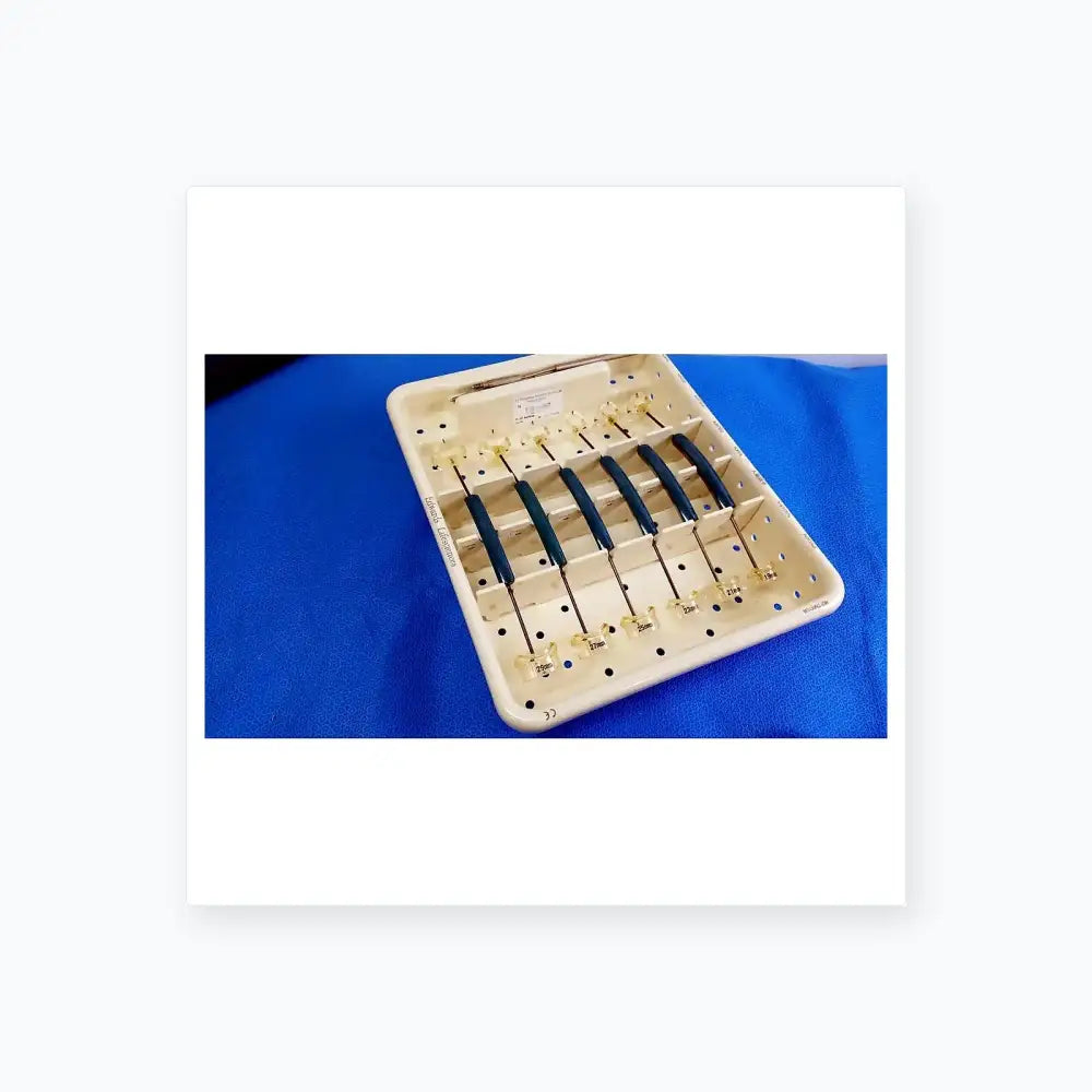 White plastic tray with six blue-handled edwards life science perimount magnas ease aortic valve sizer instruments for buy used medical equipment