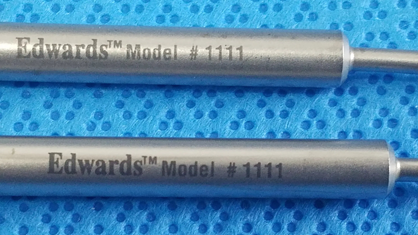 Two silver edwards model 1111 ink cartridges on blue textured surface for buy used medical equipment sale