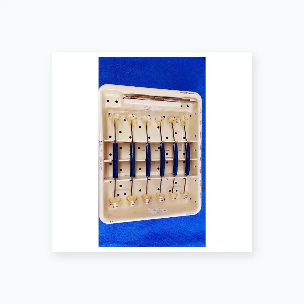 White plastic tray holding six blue-handled edwards life science 1111 perimount aortic valve sizers for buy used medical equipment