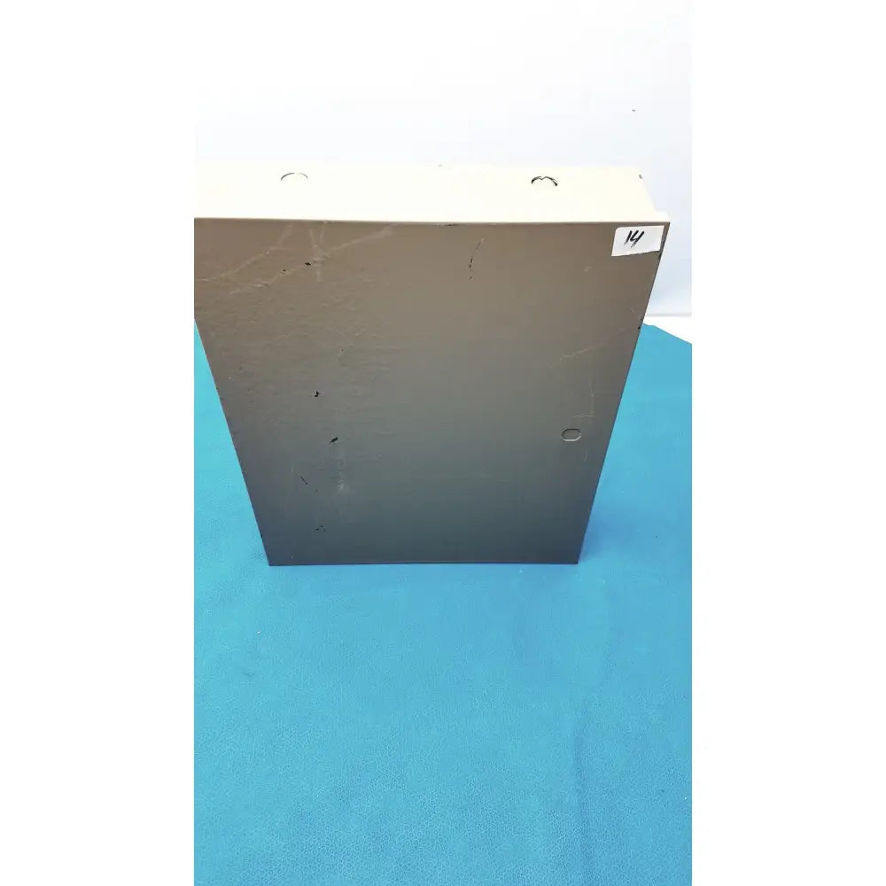 Beige and dark gray metal electrical control panel enclosure with four mounting holes and time delay relay features