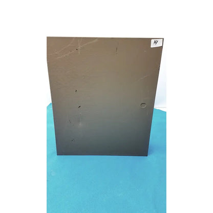 Brown metal electrical control panel with time delay relay shows scratches and small circular hole on its surface