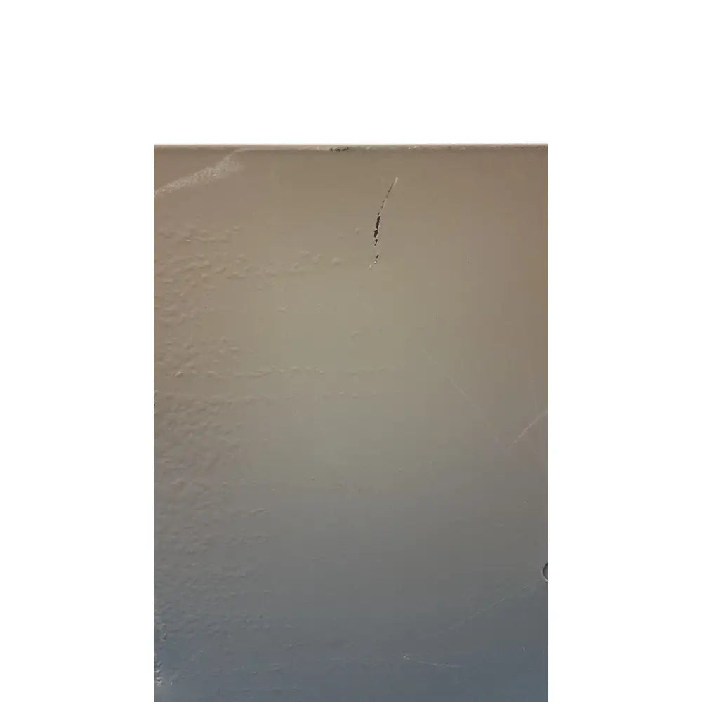 Beige textured wall background with minor scratches behind electrical control panel with time delay relay and transformers