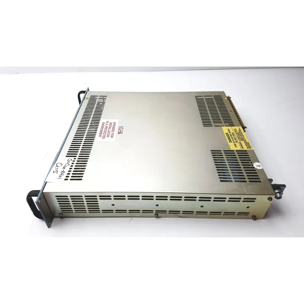 Silver metallic electronic measurements ems power supply with ventilation grilles and warning labels showing the back side