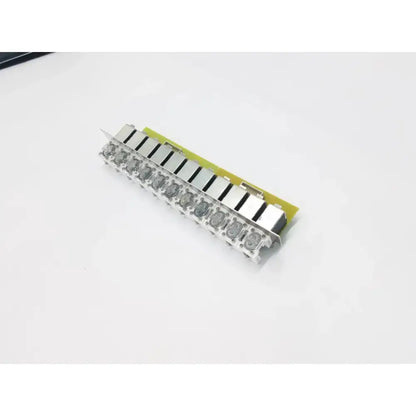 Silver-colored electrovalves solenoid manifold cbd181ae2-a with green circuit board and 11 rectangular relays in a row