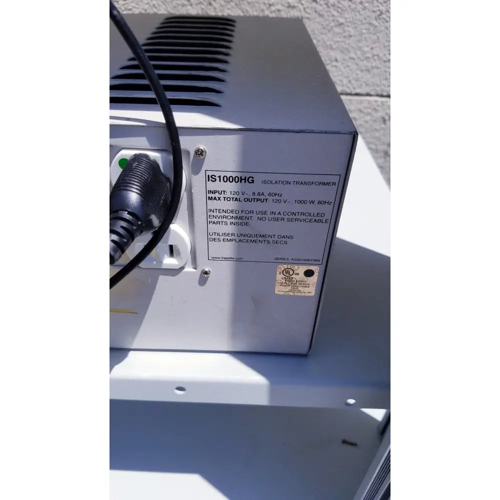 Silver metal industrial isolation transformer with ventilation slits and black power cord for ellex eyecubed ultrasound biomicroscopy system