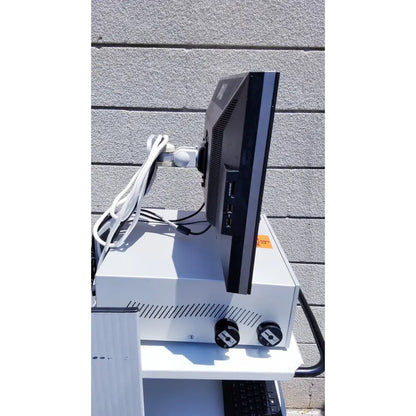 Black monitor with silver trim mounted on white stand of ellex eyecubed ultrasound biomicroscopy system as-is
