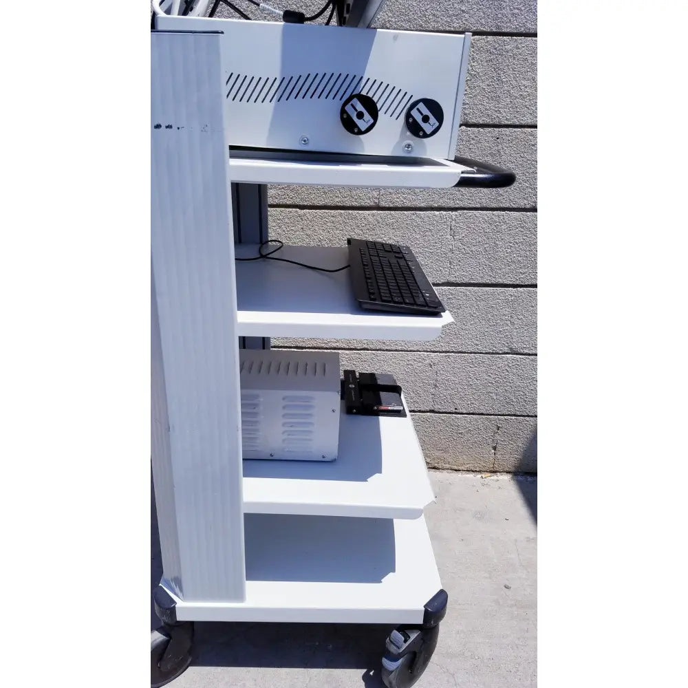 White medical cart with black wheels and keyboard for ellex eyecubed ultrasound biomicroscopy system with stand extras as-is