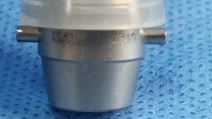 Silver-colored metallic ellik evacuator adapter with engraved markings and translucent cap compatible endoscopic systems