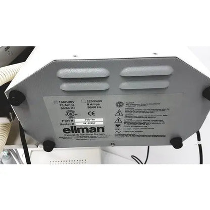 Gray metallic ellman surgical smoke evacuation system svd110 back panel showing specifications and safety warnings