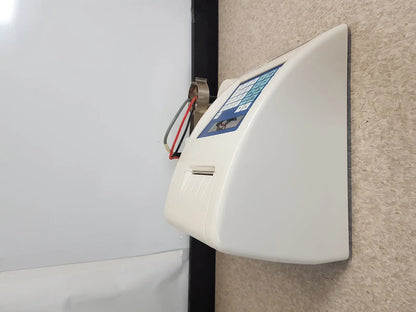White wall-mounted ticket validator with blue keypad and ticket slot for science hiranuma aquastar c3000 coulometric titrator