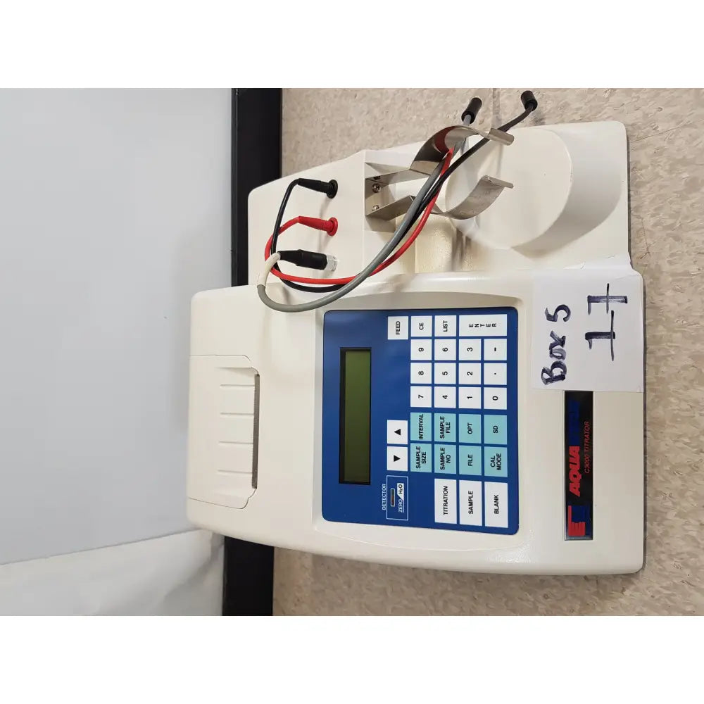 White plastic science hiranuma aquastar c3000 coulometric titrator with blue control panel and red black test leads