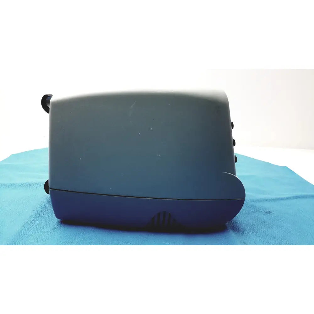 Dark gray and navy blue plastic emerson ca3200 airflow unit with rounded edges and black circular side buttons for hvac systems