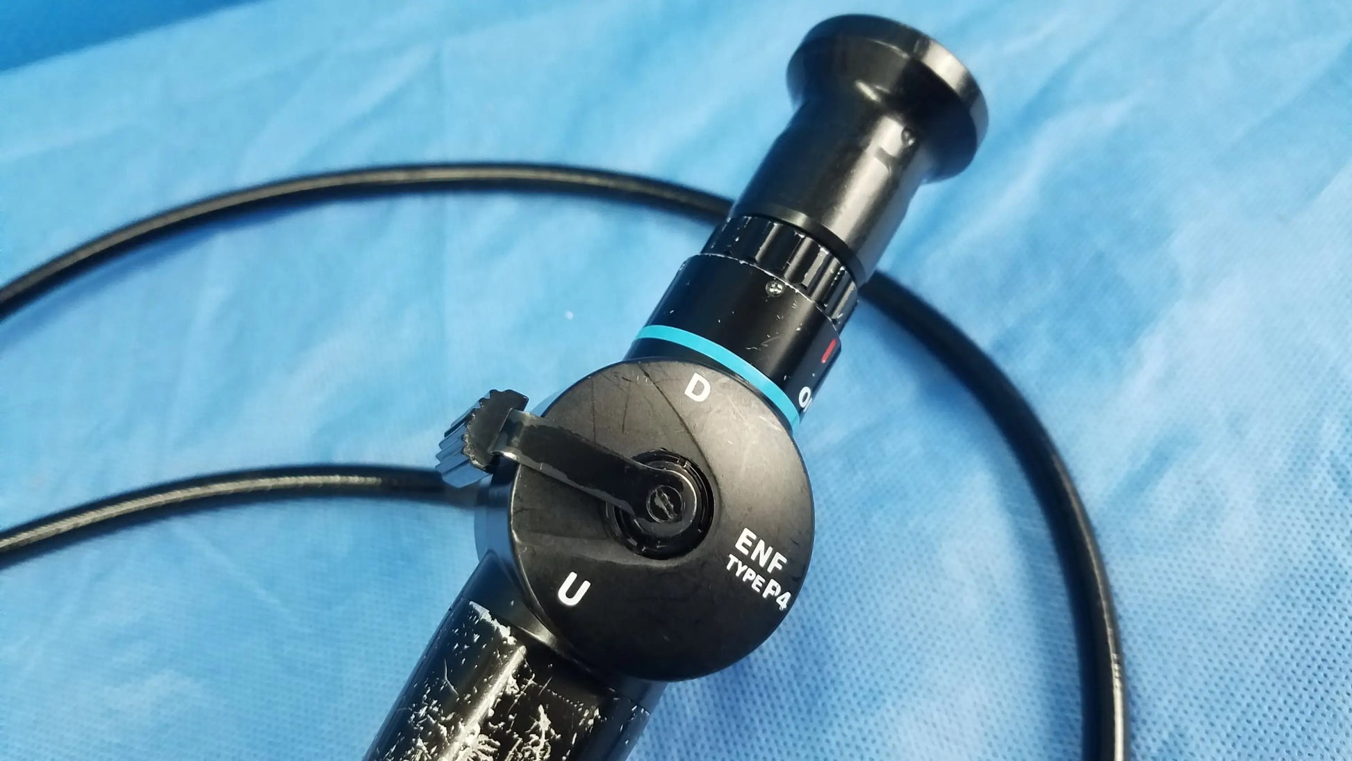 Black enf type p4 flexible fiber optic endoscope with textured grip and blue accent ring for rhino-laryngoscope use