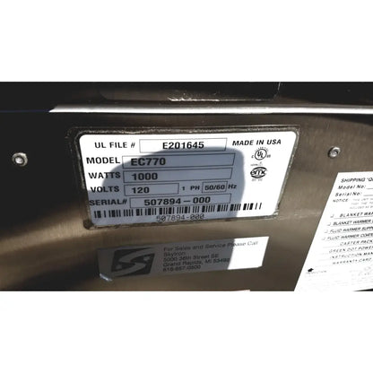 Silver metallic label with black text and barcode showing model ec770 on back of enthermics medical systems ec770 fluid warmer
