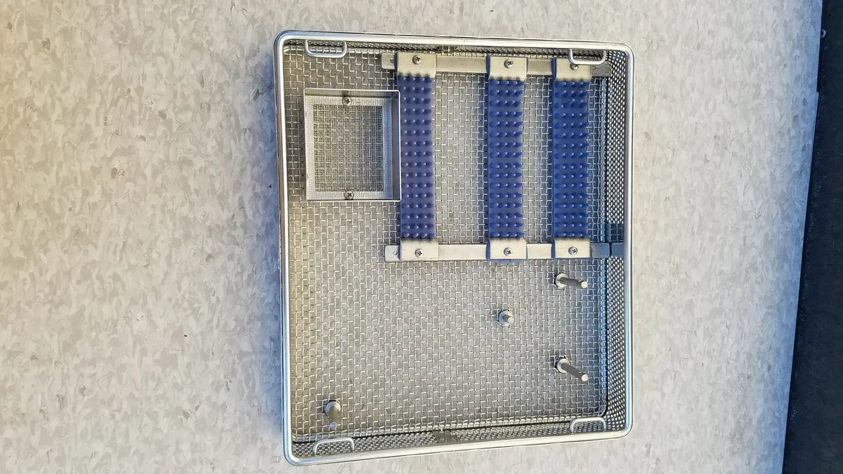 Entific sterilization case tray with three blue rubberized compartments and mesh interior made of stainless steel