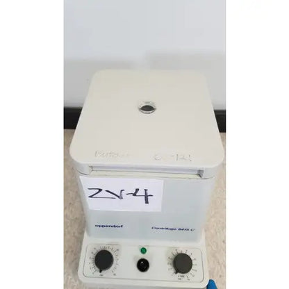 White plastic eppendorf 5415c centrifuge with black control knobs and green indicator light for reuse medical applications