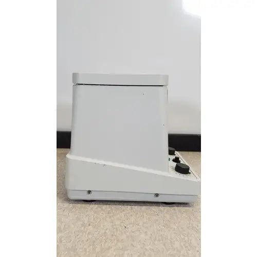 White plastic eppendorf 5415c centrifuge with black control knobs on the front panel for laboratory use