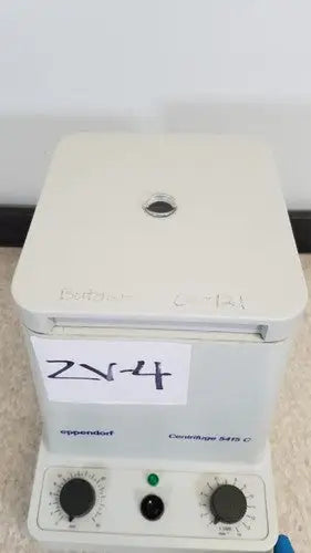 White plastic eppendorf 5415c centrifuge with black control knobs and green indicator light for reuse medical applications